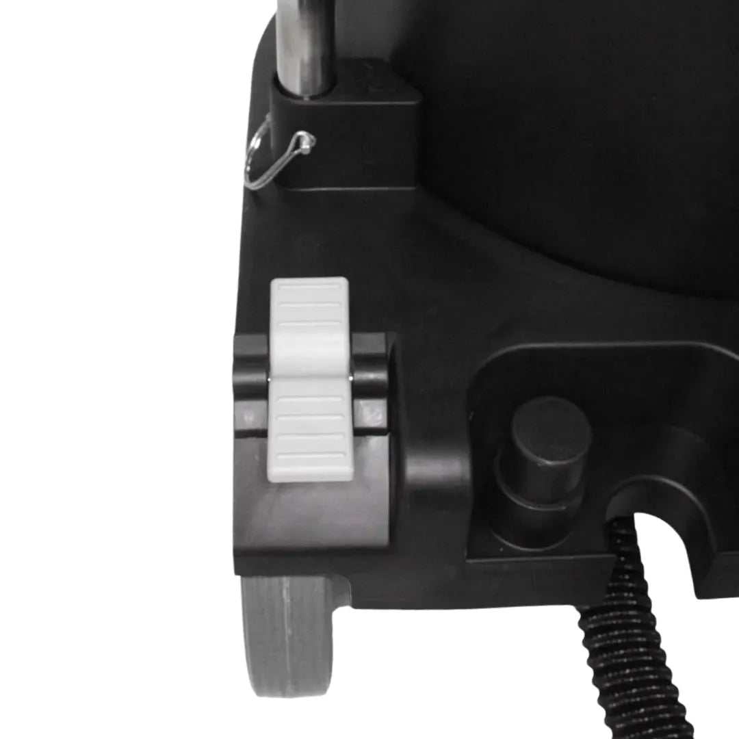 Top-down view of Maxx Pro Vac base showing grey foot pedal release and accessory storage slots