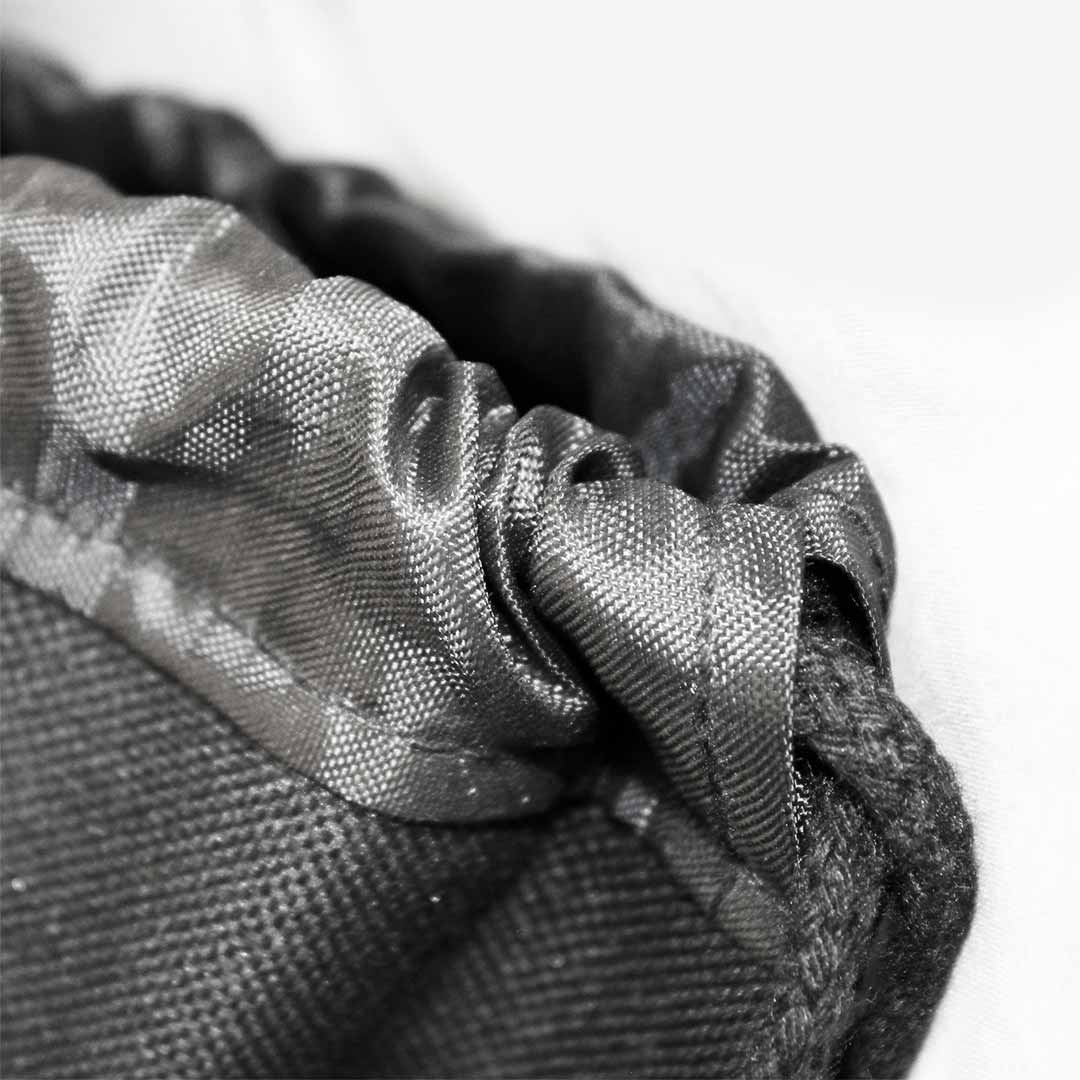 Close-up of the bag's nylon mesh fabric highlighting the detailed weaves and durable stitching.