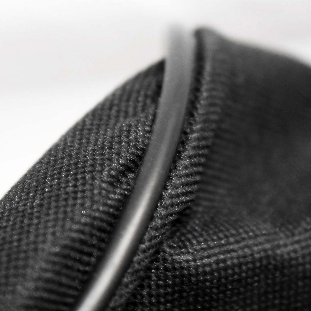 Close-up of the black accessory bag showing edge stitching and reinforced seam for durability.