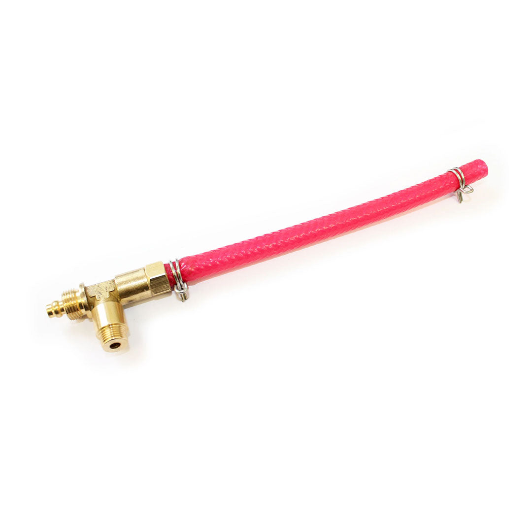 Brass T-piece connected to a reinforced red tube with clamps.