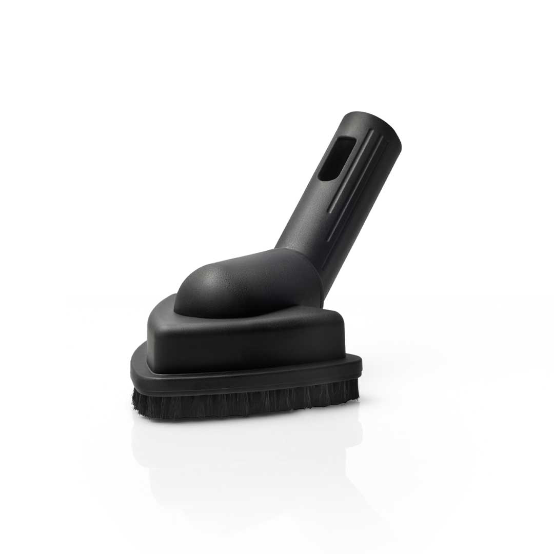 Aqua Pro Steamer's triangular brush attachment for reaching and cleaning tight corners and angled spaces.