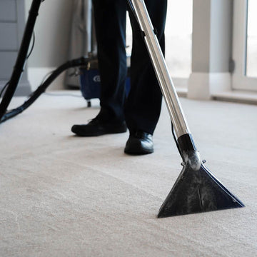 Aqua Pro Vac - Being used with the staineless steel wand extension and carpet nozzle connected to the extractor machine.