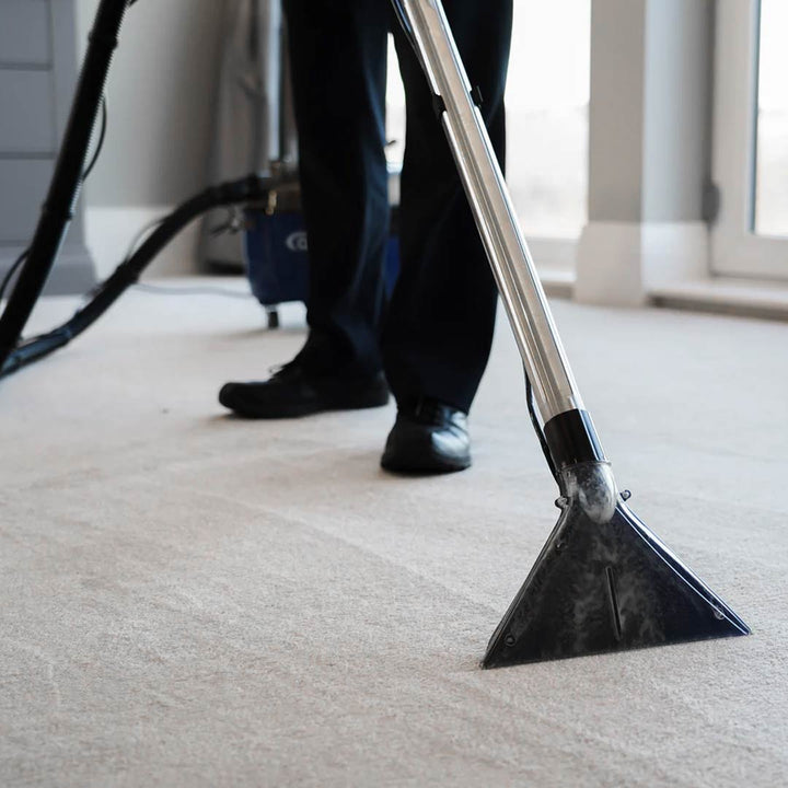 Aqua Pro Vac - Being used with the staineless steel wand extension and carpet nozzle connected to the extractor machine.